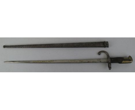 A French 1874 pattern epee bayonet, the 52cm steel blade inscribed Chatellerault 1876 in steel scabbard, 66cm overall