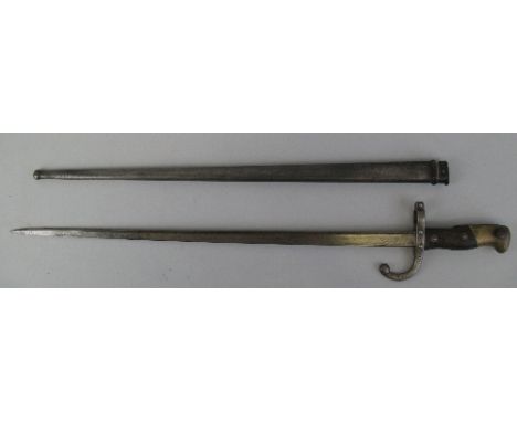 A French 1874 pattern epee bayonet, the 52cm steel blade inscribed St Etienne 1878 in steel scabbard, 66cm overall