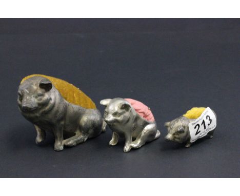 Three vintage pig pin cushions