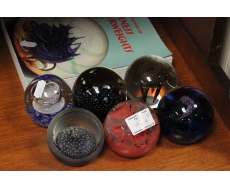 Six caithness glass paperweights plus a related book