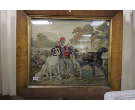 A wool work tapestry of a 19th century girl and dog in a Georgian garden setting contained within antique maple frame
