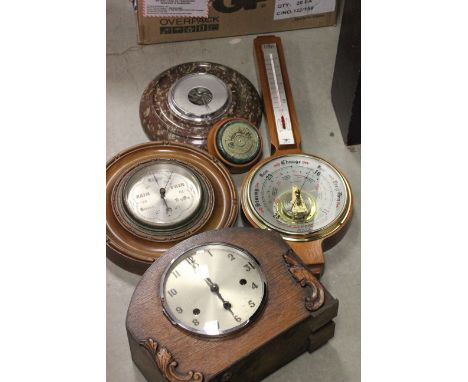 Collection of vintage barometers and a clock