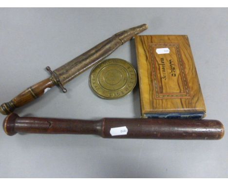 A vintage wooden fishing priest, a bowie type knife, a jewish olivewood album, and a Cirencester yellow brass school badge