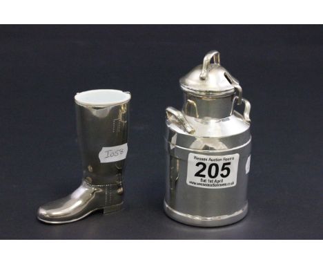 A novelty plated creamer and ladle in the form of a churn and a shot measure in the form of a boot 