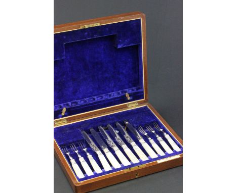 An oak cased Cross Bros of Cardiff silver plated and mother of pearl handled knives and forks 