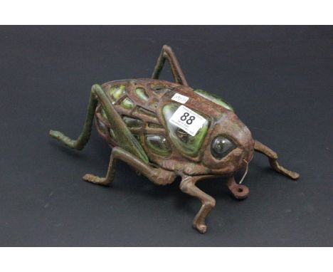 Large vintage cast iron & glass lamp in the form of a cricket