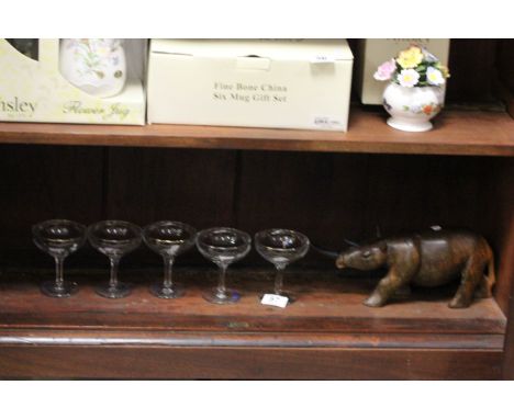 Five vintage Babycham glasses and an African carved wooden Rhino