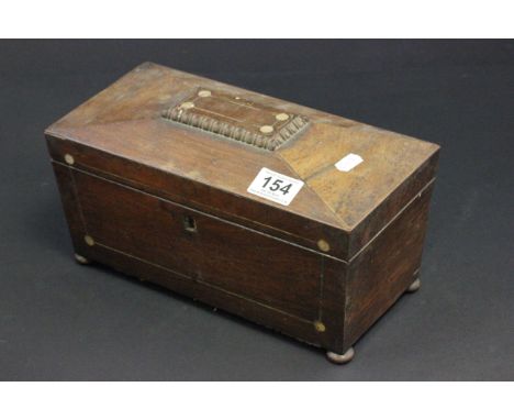 An antique 19th century mahogany tea caddy with fitted interior to include mixing bowl
