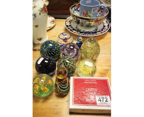 a group of glass paperweights to include Mdina and Caithness