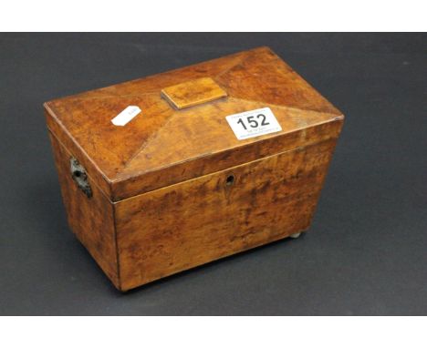 An early 19th century walnut Sarcophagus shaped tea caddy with fitted interior