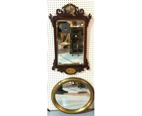 A CHIPPENDALE STYLE MAHOGANY FRETWORK PIER MIRROR (2)53cm wide; 88cm high, and a modern oval gilt framed wall mirror, 50cm di