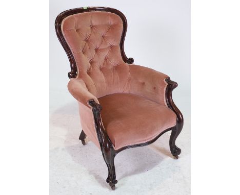 A VICTORIAN MAHOGANY FRAMED LOW ARMCHAIRWith button back upholstery, 68cm wide; 105cm high
