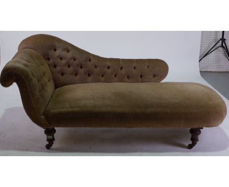 A VICTORIAN MAHOGANY FRAMED CHAISE LONGUEWith green button back upholstery on turned supports, 160cm wide; 78cm high