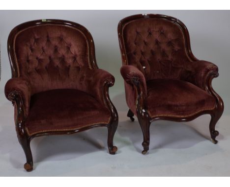 A MATCHED PAIR OF VICTORIAN MAHOGANY FRAMED ARMCHAIRS (2)Each with button back upholstery, 76cm wide; 91cm highOld marks and 
