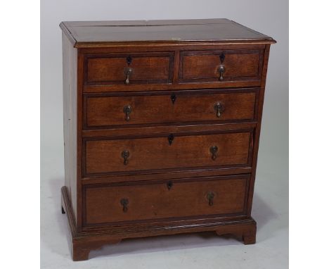 A LATE 18TH CENTURY OAK CHESTOf two short drawers, over three graduated long drawers, raised on bracket feet, 77cm wide; 87cm