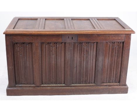 AN 18TH CENTURY AND LATER OAK COFFER WITH LINEN FOLD PANEL DECORATION122cm wide; 68cm high