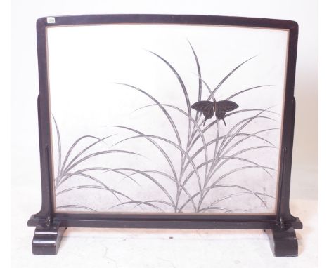 A MID 20TH CENTURY BLACK LACQUERED FIRE SCREEN105cm wide; 103cm high