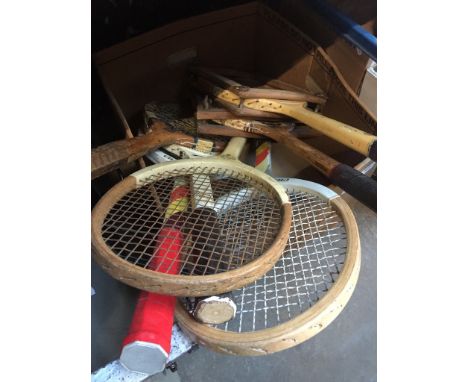 A box of vintage tennis rackets 