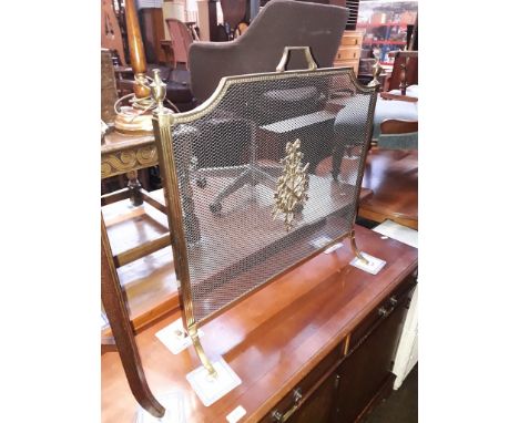 A brass fire screen, 67cm x 68cm. 