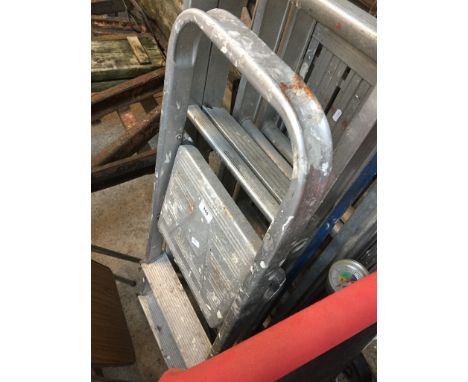 A small set of aluminium step ladders 