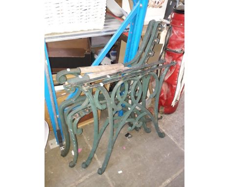 Cast iron bench ends and two table legs 