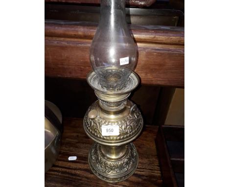 A brass oil lamp with funnel, labled 'MANUFACTURED IN GERMANY FOR S P CATERSON LONDON SE' 