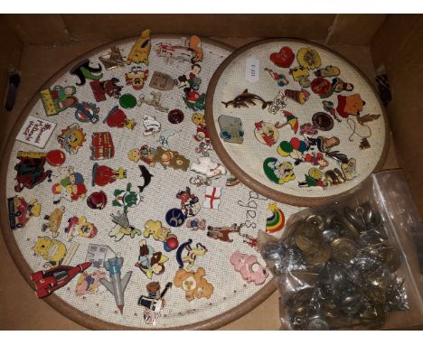 Two trays of enamel badges and a bag of buttons etc. 