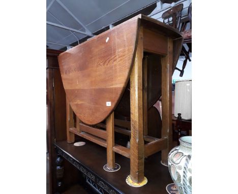 A joined oak gate leg table, 'G.T Rackstraw Ltd.' 