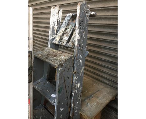 Two sets of wooden step ladders 