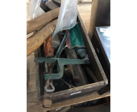 A box of old tools and a bag of axes and axe blades