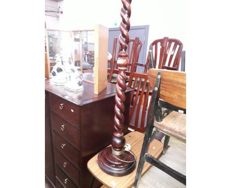 A stained pine twist pillar standard lamp. 