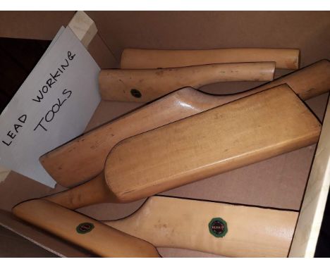 A box of wooden lead working tools 
