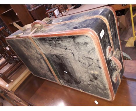 A vintage suitcase including two hangers marked 'WILT TRUNK CO. EST 1862 CHICAGO' 