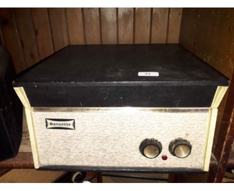 A Dansette record playerCondition:--No major damage to item.-General wear through age.-Garrard autoslim.-Sold as non working 