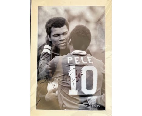 Football. Pele Signed 33x23 Black and white printed photo, Matted. Photo shows Pele giving Mohammad Ali a friendly kiss on th