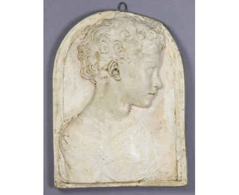 A cast plaster rectangular plaque depicting a Donatello-style bas relief portrait of a young male, with arched top, 17” x 12½