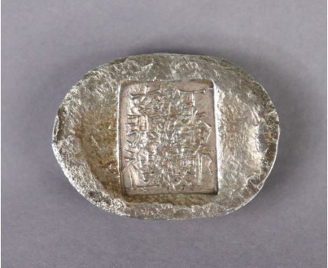 A Chinese cast silver ingot of oval shape, with seal mark to upper surface; 1¾” wide. (4.3oz). 