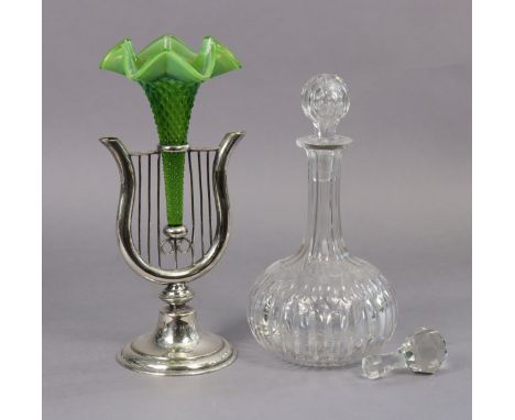 A silver-plated spill vase of lyre shape with central trumpet-shaped opalescent green glass vessel, on round pedestal foot, 1