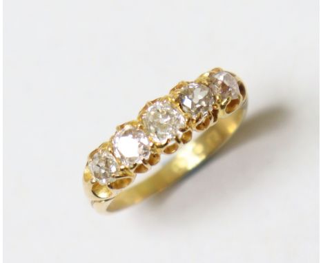 A Victorian 18ct gold ring set row of five graduated old-cut diamonds, London hallmarks for 1885, size O, 3.6g.