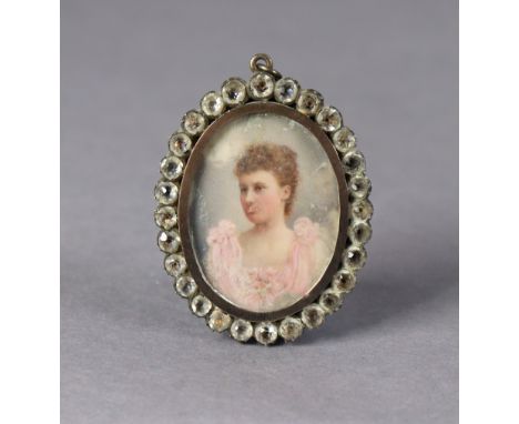 A late 19th/early 20th century oval paste-set portrait miniature frame, inset portrait of a young lady (the surface worn), wi