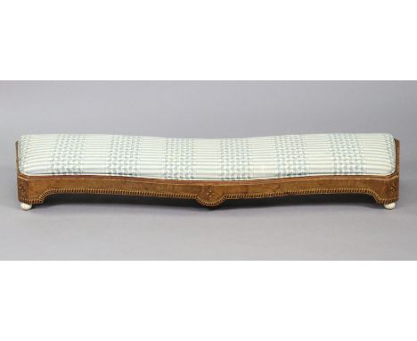 A Victorian serpentine-shaped beech fender stool with parquetry inlaid decoration, padded drop-in seat, &amp; on ceramic feet