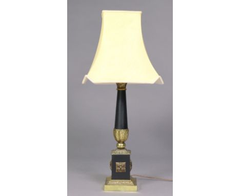 A decorative metal table lamp in the neoclassical style, with shade, 32” high x 14” wide over-all.