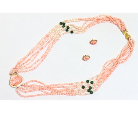 A multi-strand necklace of pink coral &amp; green jade beads and freshwater pearls, the large 9ct yellow gold pendant set car