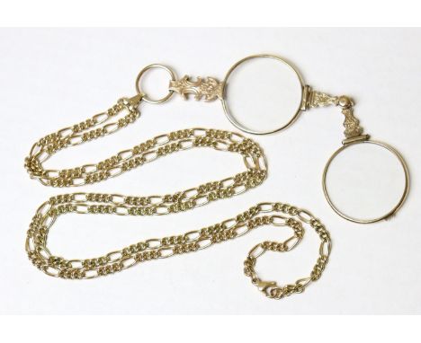 A 9ct gold lorgnette guard, 31½” long (25.4g), with pair of pendant engraved yellow metal lorgnettes (apparently un-marked).