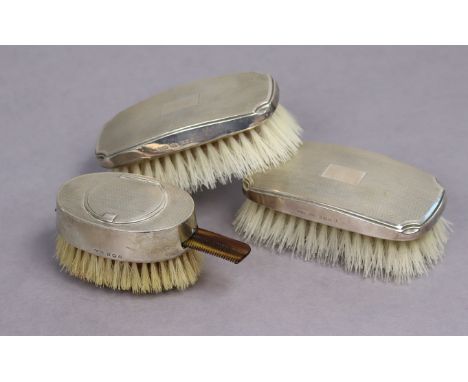 A George V silver oval engine-turned hair brush with integral powder compact &amp; comb slot, Birmingham 1927 by Wilmot Manuf