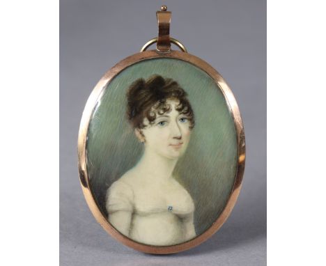 An early 19th century portrait miniature of a lady, with short brown hair in curls, wearing white blouse with blue brooch &am