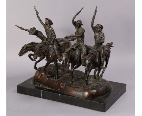 A large bronze figure group after Remington, of cowboys riding horse-back, pistols held aloft, on black marble base, 16” wide