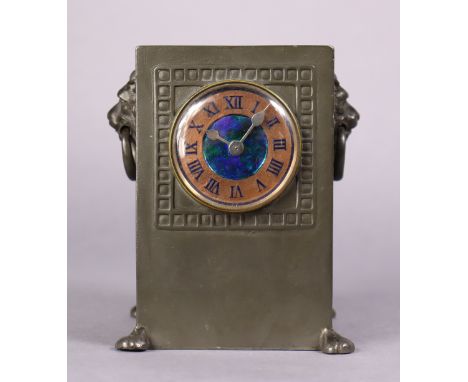 A LIBERTY &amp; Co. “TUDRIC” PEWTER COPPER &amp; ENAMEL CLOCK, the 2” dial with roman numerals &amp; inset Ruskin-type rounde