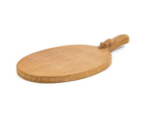 Workshop of Robert Mouseman Thompson (Kilburn): An English Oak Cheese Board, post 1960, of standard form, with carved mouse t