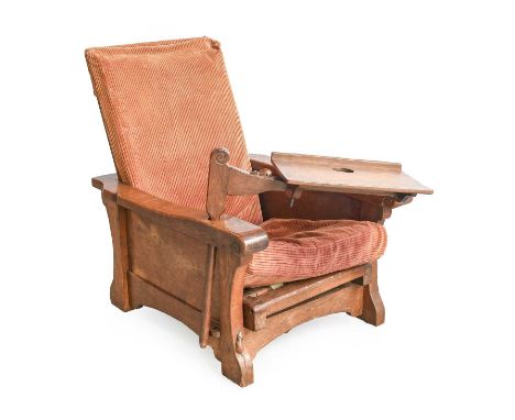 Robert Mouseman Thompson (1876-1955): An English Oak Reading Chair, circa 1930's, with adjustable ladder back and seat, shape